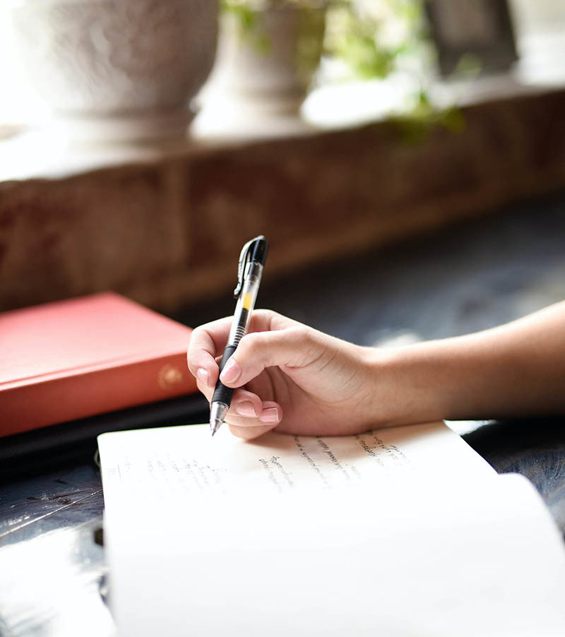 Woman writing in journal