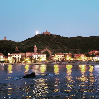 Moonrise above quaint french village